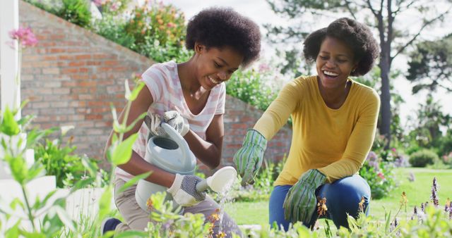 Mother and Daughter Enjoying Gardening Together in Sunny Backyard - Download Free Stock Images Pikwizard.com