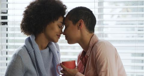 Loving lesbian couple cherishing tender moment together