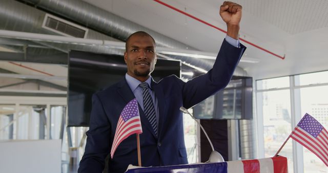 Confident African American Businessman Celebrating at Podium with USA Flags - Download Free Stock Images Pikwizard.com