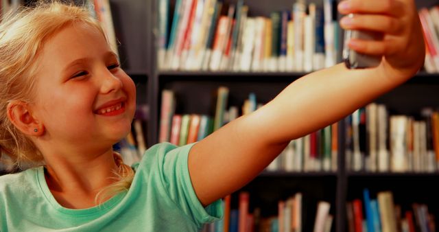 Happy Child Taking Selfie in Library - Download Free Stock Images Pikwizard.com