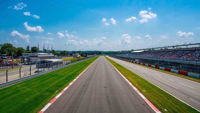 Empty diverse racing track asphalt under clear blue sky