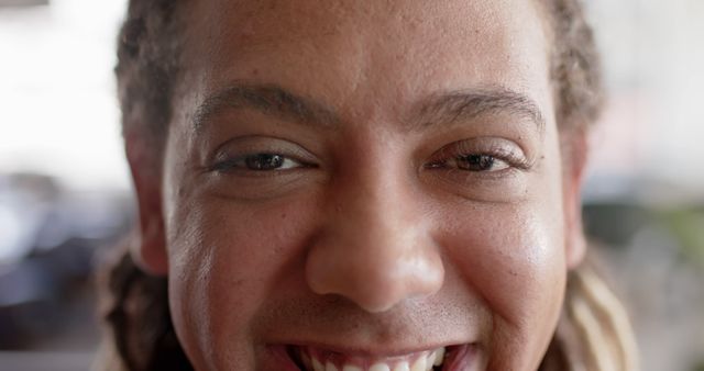 Close-Up of Smiling Young Man with Curly Hair - Download Free Stock Images Pikwizard.com