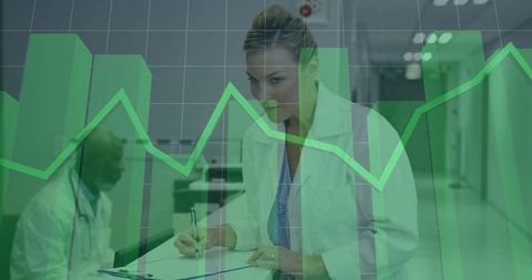 Analytical Doctor Reviewing Medical Data in Hospital