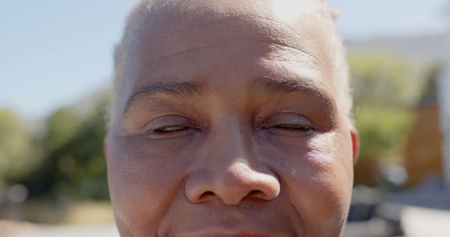 Close-up of Mature Person's Face with Eyes Closed Outdoors - Download Free Stock Images Pikwizard.com