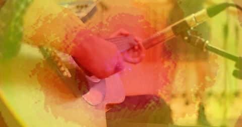 Musician Strumming Acoustic Guitar with Artistic Effects