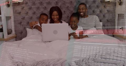 Family sharing laptop in bed showing encryption overlay, digital security togetherness