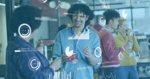 Multicultural colleagues interacting in office setting with data analytics overlay on graphs and charts. Perfect for showcasing modern business communication, teamwork, technology in coworking spaces. Useful for articles about workplace diversity, collaborative environments, and digital tools in meetings.