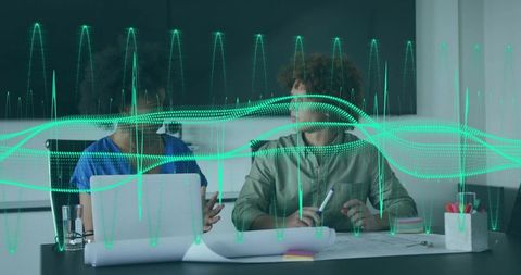 Office Team Collaborating on Technology with Digital Overlay