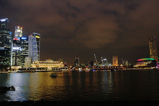 Night View of Illuminated City Skyline Reflecting on Water - Download Free Stock Photos Pikwizard.com