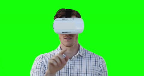 Man Engaging with Virtual Reality on Green Screen Background