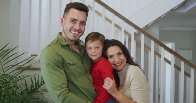 Happy Smiling Family Posing Indoors Near Staircase - Download Free Stock Images Pikwizard.com