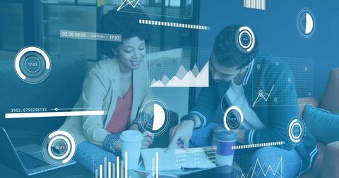 Diverse Team Analyzing Financial Data with Digital Interface in Modern Office - Download Free Stock Images Pikwizard.com