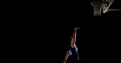 Basketball Player Practicing in Low Light Conditions with Focus and Precision - Download Free Stock Images Pikwizard.com
