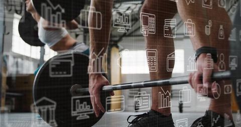 Partner deadlifting and squatting in industrial gym with data-driven icons overlay