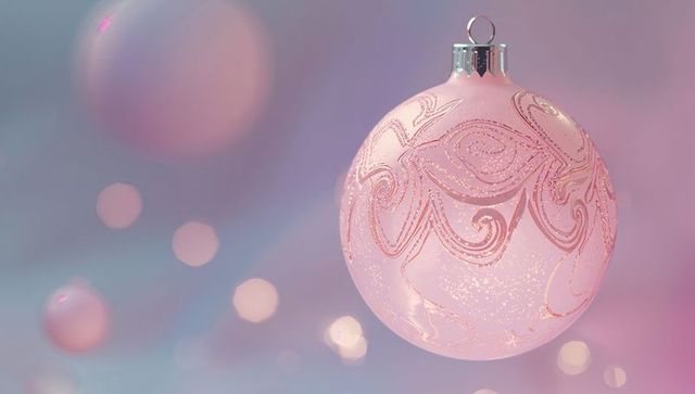 Elegant Pink Bauble with Swirling Glitter on Soft Pastel Background