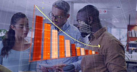 Business team analyzing financial data and charts in office