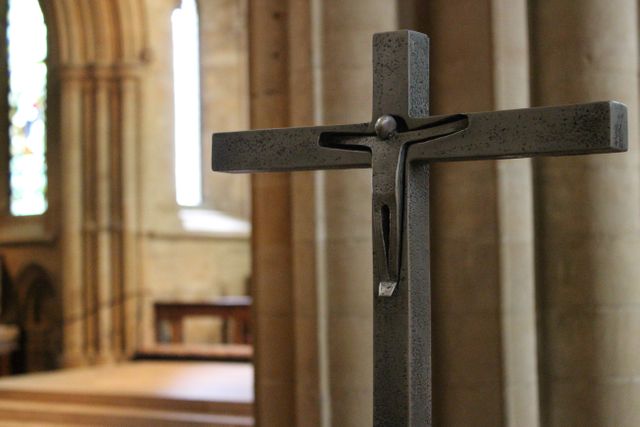 Metal Crucifix in Quiet Church Interior - Download Free Stock Photos Pikwizard.com