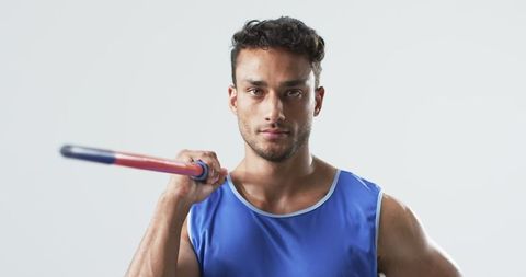 Determined athlete posing with javelin
