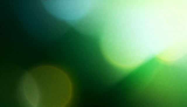 Emerald Bokeh Lightscape Glowing with Soft Lens Flare and Abstract Circles