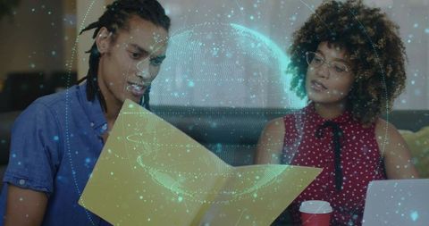 Business Team Analyzing Reports with Futuristic Globe Hologram