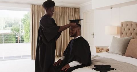 Joyful Graduation Celebration at Home with Cap and Gown Tradition