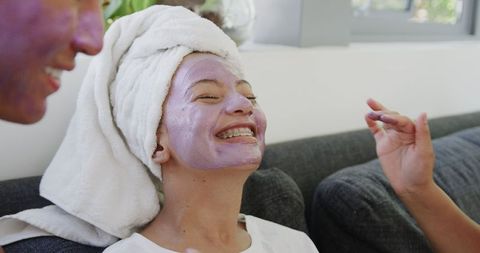 Young Woman Enjoying Relaxing Skincare Routine at Home
