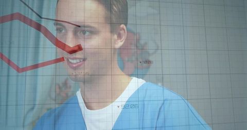 Smiling male clinician wearing blue scrubs with red health analytics overlay and grid