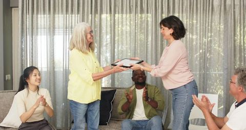 Happy Female Therapist Awarding Patient Participation Diploma