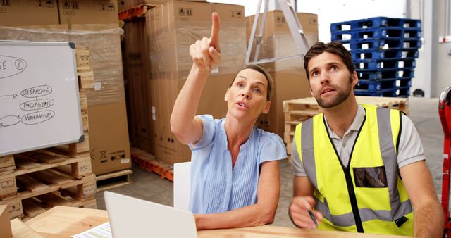 Warehouse Manager Discussing Operations with Worker - Download Free Stock Images Pikwizard.com