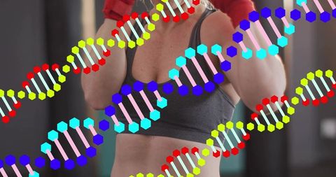 Female boxer raising gloves while training with dna helix overlay linking fitness genetics