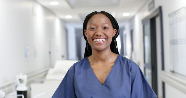 Smiling Nurse in Hospital Corridor with Braided Hair - Download Free Stock Images Pikwizard.com