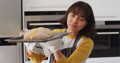 Woman Baking Homemade Bread in Modern Kitchen - Download Free Stock Images Pikwizard.com