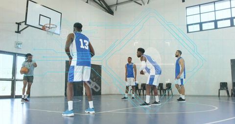 Five basketball players training on indoor court with digital hud analytics and drill focus