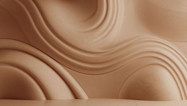 Beige sculpted plaster wall relief curved grooves ledge monochrome architectural panel