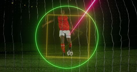 Neon Geometric Animations Over Soccer Player at Night