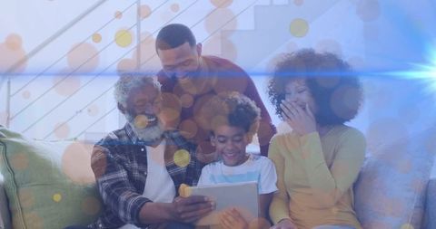 Multi-Generational Family Enjoying Tablet Together