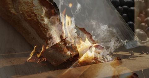 Dramatic baguette ablaze on wooden counter
