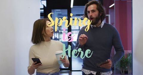 Diverse colleagues engaging in corridor discussing plans