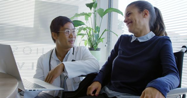 Doctor Providing Consultation to Woman in Wheelchair - Download Free Stock Images Pikwizard.com