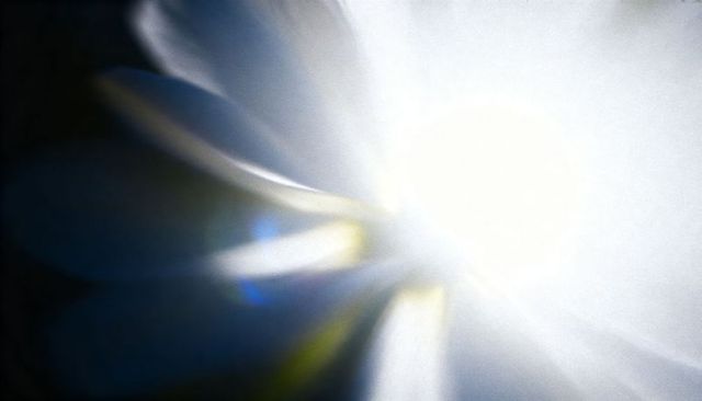 Ethereal radiant bloom with lens flare and blue fringing overexposed abstract light