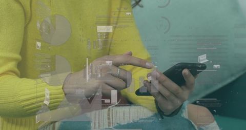 Caucasian woman engaged with smartphone and digital data projections