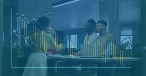 Diverse Team Meeting Analyzing Financial Data in Modern Office