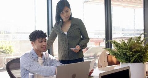 Diverse Coworkers Collaborating at Modern Office Open Space