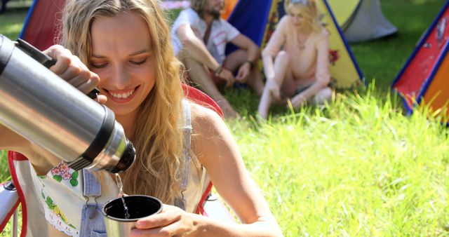 Young Woman Pouring Hot Beverage Outdoors at Campsite - Download Free Stock Images Pikwizard.com