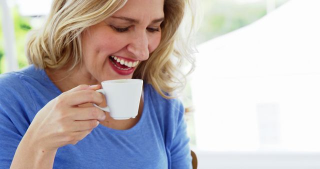 Woman Enjoying Coffee Outdoors, Smiling and Relaxing - Download Free Stock Images Pikwizard.com