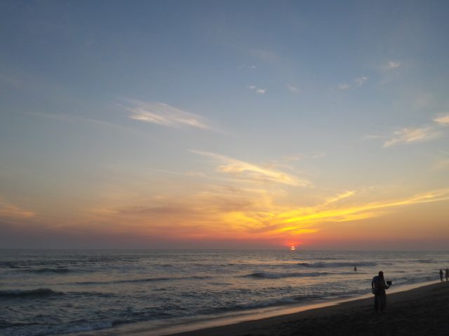 Couple Enjoying Beautiful Sunset on Serene Beach - Download Free Stock Photos Pikwizard.com