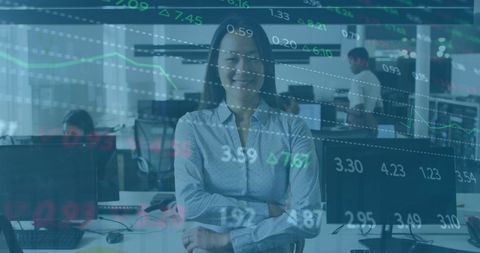 Confident Asian Businesswoman in Office with Financial Graphs Overlay - Download Free Stock Images Pikwizard.com