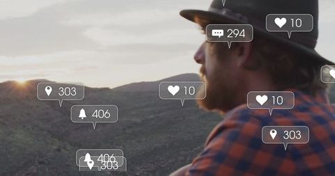 Man Enjoying Valley Sunset with Social Media Notification Icons