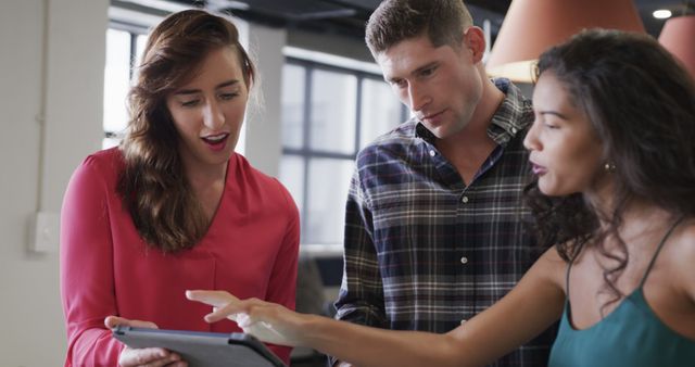 Team Discussing Project on Digital Tablet in Modern Office - Download Free Stock Images Pikwizard.com