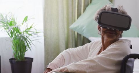 Senior Woman in Retirement Home Using VR Headset